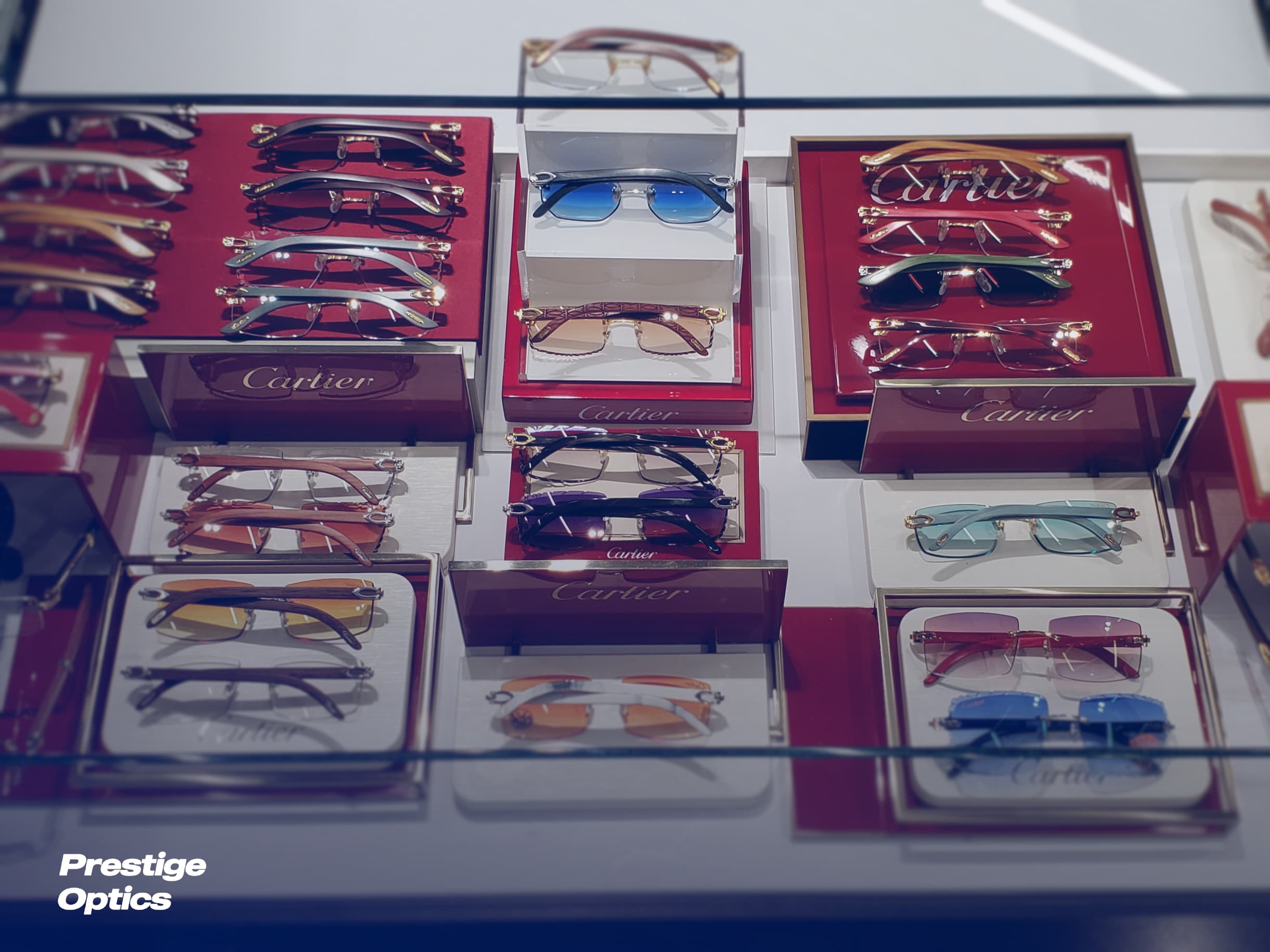 The Prestige Optics Lab team packing optical lab orders for shipment